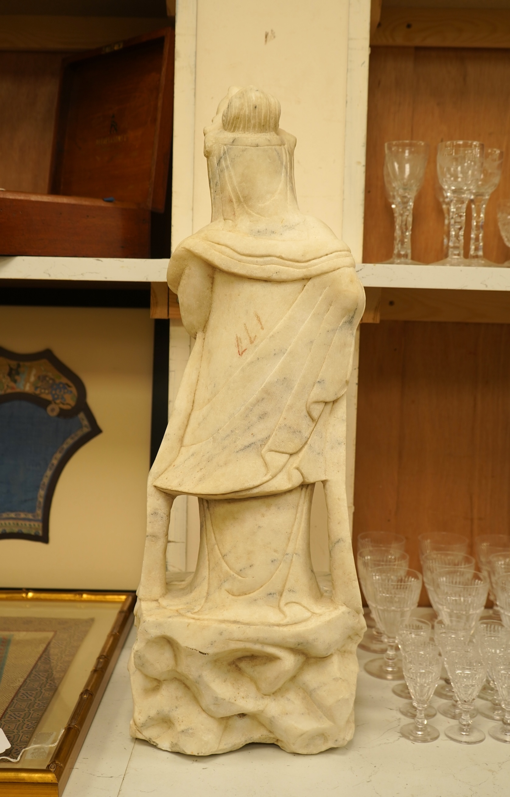 A large Chinese alabaster carving of Guanyin, 66cm high